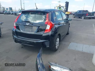 2015 Honda Fit LX z VIN 3HGGK5H52FM765921, wystawiony jako IAAI lot #42135740 z przebiegiem 82 647 mil mil oraz . Historia ofert i sprzedaży dostępna na DreamBid. Obrazek 4.
