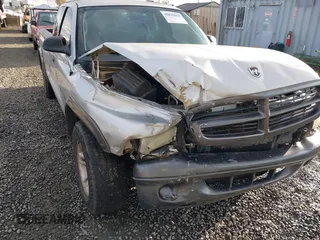 2002 Dodge Dakota with VIN 1B7GL12X42S698285, listed as a IAAI auction lot 40826030 with 211,936 mi miles and . Bid and sale history available at carsss.com. Image 6.