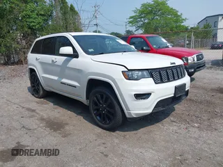 2018 Jeep Grand Cherokee Altitude z VIN 1C4RJFAG0JC348402, wystawiony jako IAAI lot #40123477 z przebiegiem 87 259 mil mil oraz . Historia ofert i sprzedaży dostępna na DreamBid. Obrazek 1.