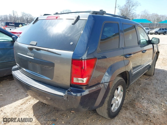 2010 Jeep Grand Cherokee Laredo with VIN 1J4PS4GK0AC112654, listed as a IAAI auction lot 41809445 with 418,301 mi miles. Bid and sale history available at carsss.com. Image 4.