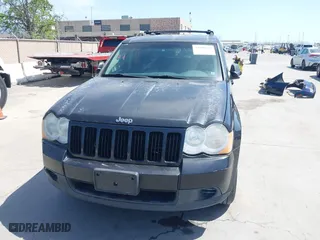 2010 Jeep Grand Cherokee Laredo with VIN 1J4PR4GK2AC104857, listed as a IAAI auction lot 42009569 with 131,986 mi miles. Bid and sale history available at carsss.com. Image 6.