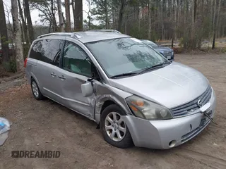 2009 Nissan Quest SL with VIN 5N1BV28U59N105982, listed as a IAAI auction lot 41795063 with 127,008 mi miles. Bid and sale history available at carsss.com. Image 1.