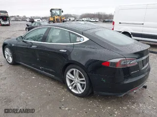 2013 Tesla Model S with VIN 5YJSA1DN9DFP03380, listed as a IAAI auction lot 41865213 with 184,831 mi miles. Bid and sale history available at carsss.com. Image 3.