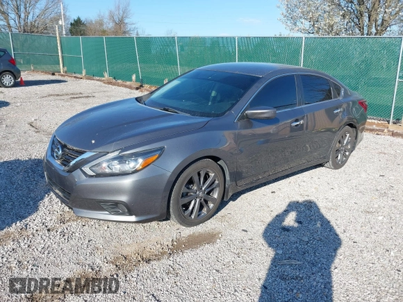 2018 Nissan Altima 2.5 SR with VIN 1N4AL3AP7JC240029, listed as a IAAI auction lot 41883209 with 77,190 mi miles. Bid and sale history available at carsss.com. Image 18.