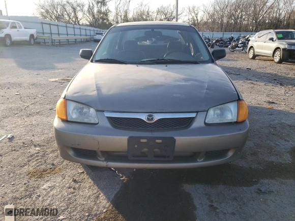 2000 Mazda Protege DX with VIN JM1BJ2222Y0238301, listed as a Copart auction lot 85283554 with 326,226 mi miles and Non Repairable. Bid and sale history available at carsss.com. Image 5.