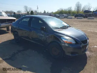 2009 Toyota Yaris with VIN JTDBT903194047784, listed as a IAAI auction lot 42049872 with 115,735 mi miles. Bid and sale history available at carsss.com. Image 1.