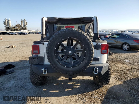 2010 Jeep Wrangler Sport with VIN 1J4AA2D16AL144842, listed as a Copart auction lot 50173535 with 106,000 mi miles and Salvage Title. Bid and sale history available at carsss.com. Image 6.