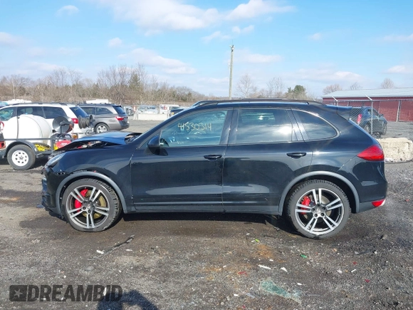 2012 Porsche Cayenne Turbo z VIN WP1AC2A23CLA84310, wystawiony jako IAAI lot #41530314 z przebiegiem 103 859 mil mil oraz . Historia ofert i sprzedaży dostępna na DreamBid. Obrazek 14.