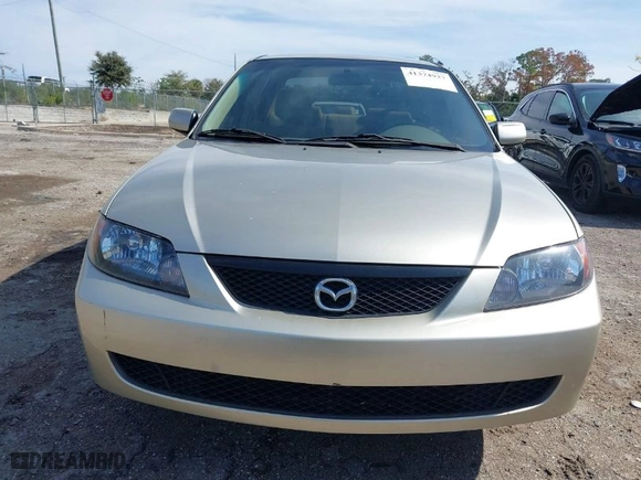 2003 Mazda Protege DX with VIN JM1BJ225731212628, listed as a IAAI auction lot 41374927 with 105,662 mi miles. Bid and sale history available at carsss.com. Image 13.