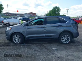 2021 Ford Edge Titanium z VIN 2FMPK3K9XMBA21766, wystawiony jako IAAI lot #42187940 z przebiegiem 79 732 mil mil oraz . Historia ofert i sprzedaży dostępna na DreamBid. Obrazek 14.