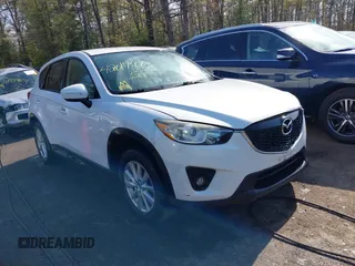 2014 Mazda CX-5 Touring with VIN JM3KE2CY5E0329783, listed as a IAAI auction lot 42017473 with 121,175 mi miles. Bid and sale history available at carsss.com. Image 1.