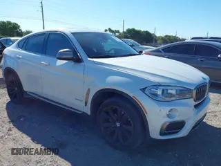 2016 BMW X6 xDrive35i with VIN 5UXKU2C57G0N81974, listed as a IAAI auction lot 41821867 with 144,643 mi miles. Bid and sale history available at carsss.com. Image 1.