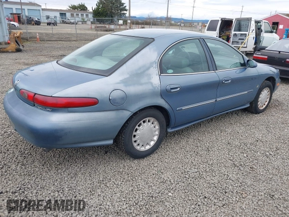 1999 Mercury Sable LS z VIN 1MEFM53S5XA647862, wystawiony jako IAAI lot #41762714 z przebiegiem 165 490 mil mil oraz . Historia ofert i sprzedaży dostępna na DreamBid. Obrazek 4.