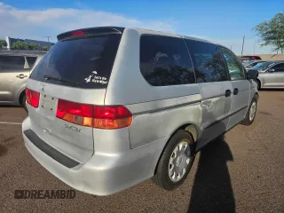 2001 Honda Odyssey LX with VIN 2HKRL18501H617598, listed as a Copart auction lot 65471805 with 125,298 mi miles and Clean title. Bid and sale history available at DreamBid. Image 3.