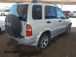 2003 Suzuki Grand Vitara z VIN JS3TD62V434101747, wystawiony jako IAAI lot #42522290 z przebiegiem 230 837 mil mil oraz . Historia ofert i sprzedaży dostępna na DreamBid. Obrazek 4.