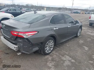 2020 Toyota Camry LE with VIN 4T1C11AK0LU400052, listed as a IAAI auction lot 41861392 with 69,341 mi miles. Bid and sale history available at carsss.com. Image 4.