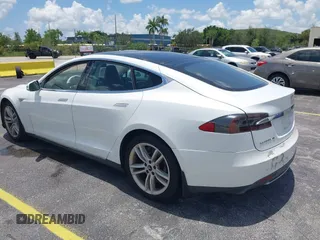 2013 Tesla Model S with VIN 5YJSA1CG4DFP21658, listed as a IAAI auction lot 42398609 with 116,068 mi miles and . Bid and sale history available at DreamBid. Image 3.