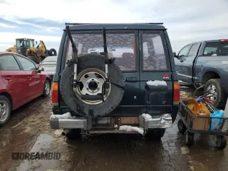 1991 Isuzu Trooper z VIN JACCH58E3M7900325, wystawiony jako Copart lot #79525294 z przebiegiem 146 593 mil mil oraz Czysty tytuł • Clean title. Historia ofert i sprzedaży dostępna na DreamBid. Obrazek 6.