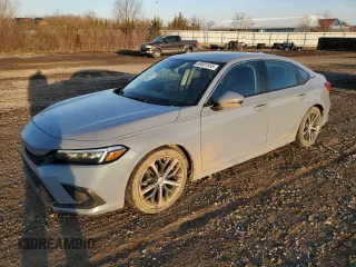 2022 Honda Civic Touring z VIN 2HGFE1F90NH324934, wystawiony jako Copart lot #48501555 z przebiegiem 99 825 mil mil oraz Szkoda całkowita • Salvage title. Historia ofert i sprzedaży dostępna na DreamBid. Obrazek 1.
