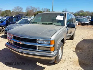 1999 Chevrolet Suburban with VIN 3GNEC16R1XG198724, listed as a IAAI auction lot 41812563 with 207,922 mi miles. Bid and sale history available at carsss.com. Image 2.