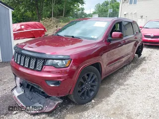2017 Jeep Grand Cherokee Altitude with VIN 1C4RJFAG0HC700419, listed as a IAAI auction lot 42553449 with 143,872 mi miles and . Bid and sale history available at DreamBid. Image 2.