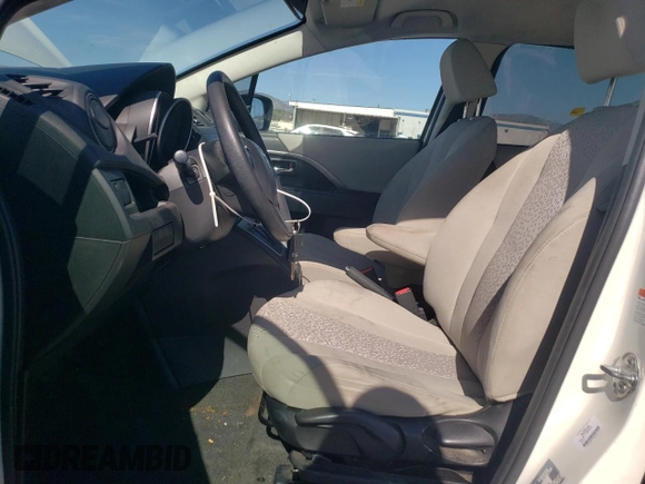 2012 Mazda 5 Sport with VIN JM1CW2BL9C0103114, listed as a Copart auction lot 49910085 with 130,850 mi miles and Salvage Title. Bid and sale history available at DreamBid. Image 7.