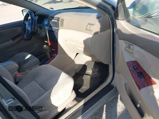 2004 Toyota Corolla CE with VIN JTDBR38E842043849, listed as a IAAI auction lot 41703290 with 299,999 mi miles. Bid and sale history available at carsss.com. Image 5.