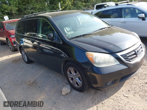 2010 Honda Odyssey Touring with VIN 5FNRL3H96AB031016, listed as a IAAI auction lot 42828397 with 261,881 mi miles and . Bid and sale history available at DreamBid. Image 1.