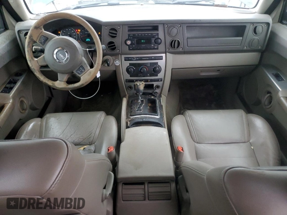 2006 Jeep Commander with VIN 1J8HH48NX6C125803, listed as a Copart auction lot 71247304 with 214,297 mi miles and Salvage Title. Bid and sale history available at carsss.com. Image 8.