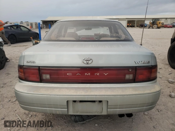 1994 Toyota Camry XLE with VIN JT2GK13E0R0039215, listed as a Copart auction lot 79532404 with 109,104 mi miles and Salvage Title. Bid and sale history available at carsss.com. Image 6.