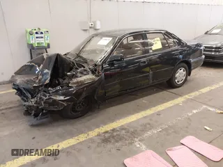 1994 Toyota Camry LE with VIN JT2SK12E3R0207215, listed as a IAAI auction lot 41788670 with 124,010 mi miles. Bid and sale history available at carsss.com. Image 2.
