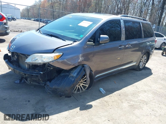 2015 Toyota Sienna XLE with VIN 5TDYK3DC6FS645065, listed as a IAAI auction lot 41937548 with 355,732 mi miles. Bid and sale history available at carsss.com. Image 2.
