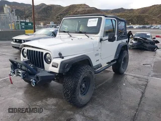 2001 Jeep Wrangler Sport with VIN 1J4FA49S41P308407, listed as a IAAI auction lot 41772240 with 139,461 mi miles. Bid and sale history available at carsss.com. Image 17.