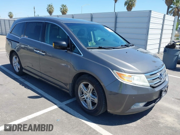 2012 Honda Odyssey Touring with VIN 5FNRL5H98CB011297, listed as a IAAI auction lot 42207061 with 154,073 mi miles and . Bid and sale history available at DreamBid. Image 1.