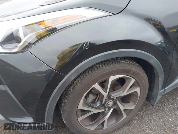 2018 Toyota C-HR XLE with VIN JTNKHMBX6J1000904, listed as a IAAI auction lot 42513117 with 77,192 mi miles and . Bid and sale history available at DreamBid. Image 6.