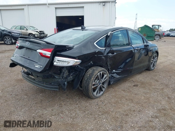 2020 Ford Fusion Titanium with VIN 3FA6P0D9XLR174523, listed as a IAAI auction lot 42100113 with 100,602 mi miles and . Bid and sale history available at DreamBid. Image 4.