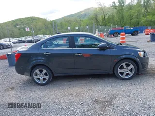 2016 Chevrolet Sonic LTZ z VIN 1G1JE5SB5G4137710, wystawiony jako IAAI lot #42131625 z przebiegiem 152 941 mil mil oraz . Historia ofert i sprzedaży dostępna na DreamBid. Obrazek 13.