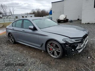2023 BMW 5 Series M550i xDrive with VIN WBA13BK06PCN02733, listed as a Copart auction lot 48767235 with 27,725 mi miles and Salvage title. Bid and sale history available at DreamBid. Image 4.