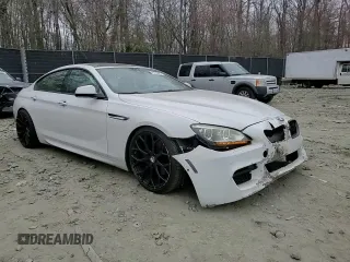 2014 BMW 6 Series 650i xDrive z VIN WBA6B4C54ED371324, wystawiony jako Copart lot #49016325 z przebiegiem 113 395 mil mil oraz Szkoda całkowita • Salvage title. Historia ofert i sprzedaży dostępna na DreamBid. Obrazek 11.