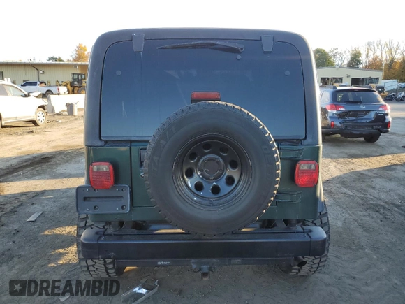 1999 Jeep Wrangler Sport with VIN 1J4FY19S5XP482053, listed as a Copart auction lot 75925774 with 112,503 mi miles and Salvage Title. Bid and sale history available at carsss.com. Image 6.