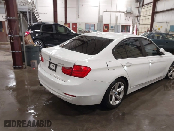 2014 BMW 3 Series 328i with VIN WBA3C1C52EK112194, listed as a IAAI auction lot 41694770 with 139,609 mi miles. Bid and sale history available at carsss.com. Image 4.