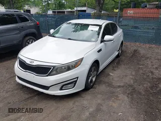 2015 Kia Optima LX with VIN KNAGM4A7XF5599309, listed as a IAAI auction lot 42493215 with 143,703 mi miles and . Bid and sale history available at DreamBid. Image 2.