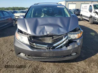 2014 Honda Odyssey Touring with VIN 5FNRL5H94EB116891, listed as a Copart auction lot 61400725 with 202,972 mi miles and Salvage title. Bid and sale history available at DreamBid. Image 5.