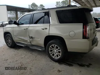 2015 GMC Yukon SLE with VIN 1GKS1AKC5FR120713, listed as a Copart auction lot 48009325 with 133,372 mi miles and Salvage Title. Bid and sale history available at carsss.com. Image 2.
