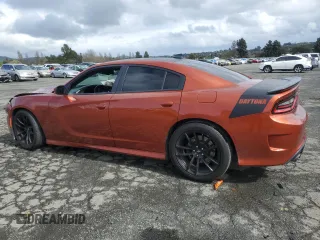 2021 Dodge Charger Scat Pack Widebody with VIN 2C3CDXGJXMH523279, listed as a Copart auction lot 51343765 with 53,976 mi miles and Salvage Title. Bid and sale history available at carsss.com. Image 2.