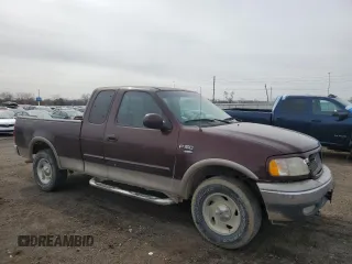 2001 Ford F-150 XL with VIN 1FTRX18L61NB40999, listed as a Copart auction lot 49641305 with 216,452 mi miles and Salvage Title. Bid and sale history available at carsss.com. Image 4.