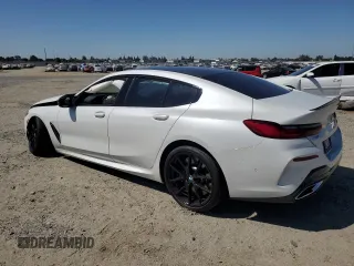 2023 BMW 8 Series M850i with VIN WBAGV8C0XPCK39846, listed as a Copart auction lot 61173594 with 0 mi miles and Salvage Title. Bid and sale history available at carsss.com. Image 2.