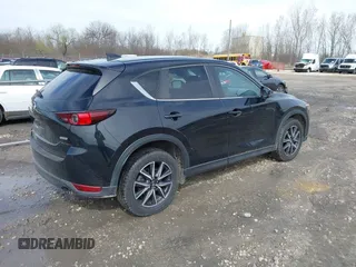 2018 Mazda CX-5 Touring with VIN JM3KFBCMXJ0438177, listed as a IAAI auction lot 42152275 with 65,434 mi miles and . Bid and sale history available at carsss.com. Image 4.