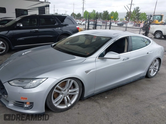 2014 Tesla Model S 60 with VIN 5YJSA1H12EFP32213, listed as a IAAI auction lot 42194085 with 56,071 mi miles and . Bid and sale history available at DreamBid. Image 18.