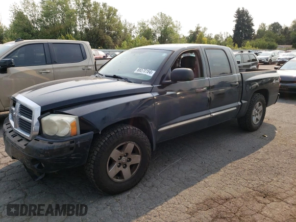 2005 Dodge Dakota Laramie with VIN 1D7HW58N65S161629, listed as a Copart auction lot 66570164 with 205,984 mi miles and Salvage Title. Bid and sale history available at DreamBid. Image 1.